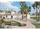 Backyard oasis featuring pool, patio, and palm trees at 15825 Redington Dr, Redington Beach, FL 33708