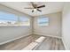 Bright bedroom with ceiling fan and vinyl plank flooring at 1701 62Nd S Ter, St Petersburg, FL 33712
