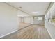 Open living room with kitchen view and wood-look floors at 1701 62Nd S Ter, St Petersburg, FL 33712