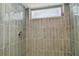 Shower stall with grey tile and window for ventilation at 1701 62Nd S Ter, St Petersburg, FL 33712