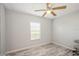 Simple bedroom with light grey walls and wood-look floors at 233 Tarpon Ln, Oldsmar, FL 34677