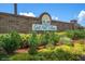 Gull Aire Village entrance with brick wall and landscaping at 233 Tarpon Ln, Oldsmar, FL 34677
