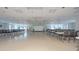 Large community room with tables and chairs, perfect for gatherings at 233 Tarpon Ln, Oldsmar, FL 34677
