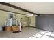Enclosed patio with ceiling fan, storage cabinets and access to home at 233 Tarpon Ln, Oldsmar, FL 34677