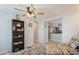 Living room with floral armchair and view into kitchen at 233 Tarpon Ln, Oldsmar, FL 34677