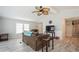 Living room with brown couch and view into kitchen and entryway at 233 Tarpon Ln, Oldsmar, FL 34677