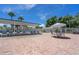 Brick paved pool deck with covered seating and lounge chairs at 233 Tarpon Ln, Oldsmar, FL 34677
