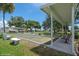 Covered outdoor shuffleboard courts with benches, great for recreation at 233 Tarpon Ln, Oldsmar, FL 34677