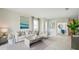 Open living room with neutral color palette and large windows at 2375 Warren Acres Blvd, Wesley Chapel, FL 33543
