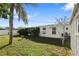 Backyard view featuring a large grassy area and home's exterior at 3839 18Th N Ave, St Petersburg, FL 33713