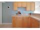 Kitchen corner with wood cabinets, a granite countertop, and wine glass rack at 3839 18Th N Ave, St Petersburg, FL 33713