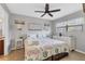 Comfortable bedroom with ceiling fan and dresser at 4621 Gulf Of Mexico Dr # D10, Longboat Key, FL 34228