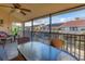Balcony with table and chairs offering a view of the community at 4621 Gulf Of Mexico Dr # D10, Longboat Key, FL 34228