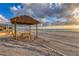 Tiki hut with picnic table on the beach at 4621 Gulf Of Mexico Dr # D10, Longboat Key, FL 34228