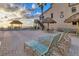 Exterior beach area with tiki hut and lounge chairs at 4621 Gulf Of Mexico Dr # D10, Longboat Key, FL 34228