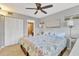 Bedroom with queen bed, closet, and ensuite bath at 4621 Gulf Of Mexico Dr # D10, Longboat Key, FL 34228