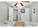 Bedroom with two twin beds and built in shelving at 4621 Gulf Of Mexico Dr # D10, Longboat Key, FL 34228