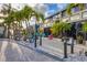 Charming condo with beautiful landscaping, colorful Adirondack chairs, and a striking facade with large windows at 4621 Gulf Of Mexico Dr # D10, Longboat Key, FL 34228