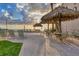 Relaxing outdoor patio features lounge chairs, tables, and shade structures overlooking the ocean at 4621 Gulf Of Mexico Dr # D10, Longboat Key, FL 34228