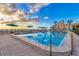 Community pool with lounge seating and sunset view at 4621 Gulf Of Mexico Dr # D10, Longboat Key, FL 34228