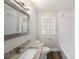 Updated bathroom with granite vanity and white subway tile at 4809 11Th S Ave, St Petersburg, FL 33711
