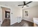 Well-lit bedroom with ceiling fan and wood-look flooring at 4809 11Th S Ave, St Petersburg, FL 33711