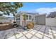 Charming house exterior with a large tree and patio at 4809 11Th S Ave, St Petersburg, FL 33711