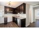 Modern kitchen with dark cabinets and granite countertops at 4809 11Th S Ave, St Petersburg, FL 33711