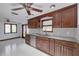 Modern kitchen with dark wood cabinets and granite countertops at 6244 Flag Dr, New Port Richey, FL 34653