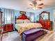 Spacious bedroom with a king-size bed and ornate wooden furniture at 8624 Fantasia Park Way, Riverview, FL 33578