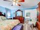Primary bedroom with king-size bed, ensuite bathroom access, and ample dresser space at 8624 Fantasia Park Way, Riverview, FL 33578