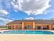 Inviting community pool with a spacious deck and plenty of seating at 8624 Fantasia Park Way, Riverview, FL 33578