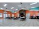 Community room with tables, chairs, and fireplace at 8624 Fantasia Park Way, Riverview, FL 33578