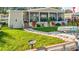 Single-wide manufactured home with covered porch, landscaped yard, and walkway at 8624 Fantasia Park Way, Riverview, FL 33578