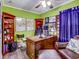 Home office with wood desk, comfortable seating, and built-in shelving at 8624 Fantasia Park Way, Riverview, FL 33578