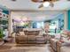 Open concept living room with view into kitchen area at 8624 Fantasia Park Way, Riverview, FL 33578