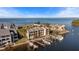Aerial view of waterfront community; boat slips and homes at 907 Bahia Del Sol Dr, Ruskin, FL 33570