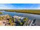 Aerial view of waterfront homes and lush landscaping at 907 Bahia Del Sol Dr, Ruskin, FL 33570