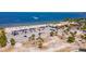 Aerial view of beach with parking lot and waterfront restaurant at 907 Bahia Del Sol Dr, Ruskin, FL 33570