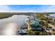 Aerial view of waterfront homes, lush landscaping, and waterway at 907 Bahia Del Sol Dr, Ruskin, FL 33570