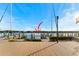 Spacious wooden deck overlooking a marina with several boats at 907 Bahia Del Sol Dr, Ruskin, FL 33570
