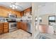 Kitchen with wood cabinets, stainless steel appliances, and granite counters at 907 Bahia Del Sol Dr, Ruskin, FL 33570