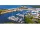 Aerial view of a marina filled with boats and a building nearby at 907 Bahia Del Sol Dr, Ruskin, FL 33570