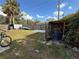 Spacious backyard with shed and various items at 10002 Memorial Hwy, Tampa, FL 33615