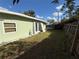 Fenced backyard with access from double doors at 10002 Memorial Hwy, Tampa, FL 33615