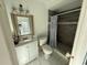 Updated bathroom features a vanity, toilet and shower at 10002 Memorial Hwy, Tampa, FL 33615