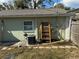 Rear house exterior showing AC unit and ladder at 10002 Memorial Hwy, Tampa, FL 33615