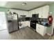 Kitchen with white cabinets and stainless steel appliances at 10002 Memorial Hwy, Tampa, FL 33615