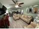Living room with light beige couches and a Christmas tree at 10002 Memorial Hwy, Tampa, FL 33615