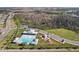 Community pool, playground, and parking area at 10347 Heron Hideaway Loop, Land O Lakes, FL 34638